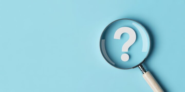 A magnifying glass focusing on a large question mark symbolizing inquiry and exploration isolated on white background