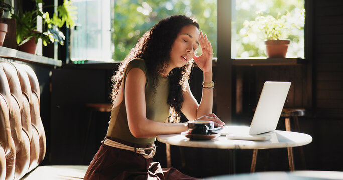 Frustrated, woman and headache with laptop in cafe for mistake, remote work or stress. Tired, female person or freelancer with migraine or fatigue on computer for deadline or pressure in coffee shop