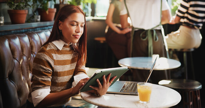 Smile, woman and reading with tablet at cafe for remote work, proofreading and editor feedback. Journalist, freelancer or editing article with tech, copywriting report and draft update for submission