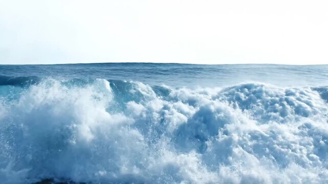 Massive ocean wave crashing, powerful blue water, sea spray, and white foam