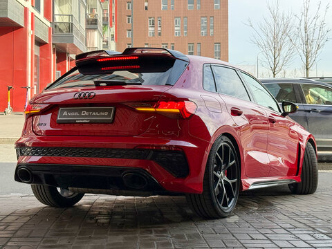 Audi RS-3 Sportback red color CARBON BLACK TFSI in showroom, luxury sport car exterior. The modern exterior of a premium Germany car Audi RS-3 red. VAG group car. 