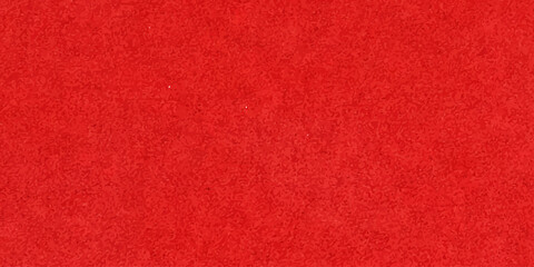 Fototapeta premium A textured red carpet background with a vintage grunge surface and rough fabric material design suitable for a Christmas backdrop or cloth textile wallpaper