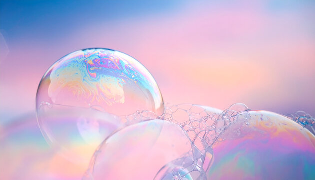 Close up of iridescent soap bubbles floating in a soft colorful background