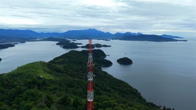 drone view Telecommunications tower rises above tropical coastal landscape in Angra dos Reis, Brazil