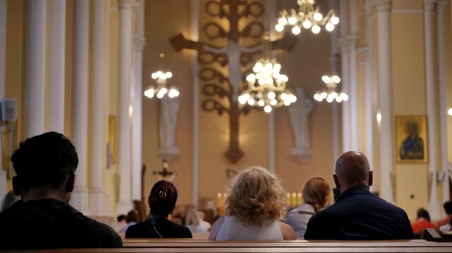 Congregation worshipping in a Catholic church during a mass or religious service