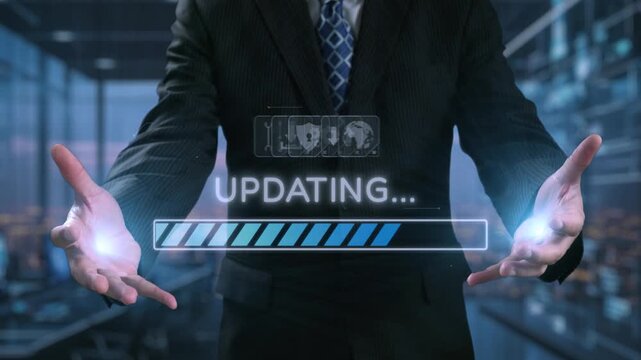 A businessman stands in a modern office environment with hands outstretched, displaying a digital screen showcasing a data updating progress bar, symbolizing technological advancement. Qubit