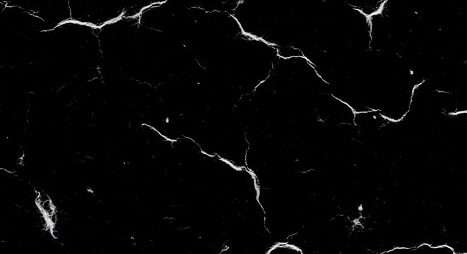 Close-up view of a dark paper texture with cracks and creases on its surface.
