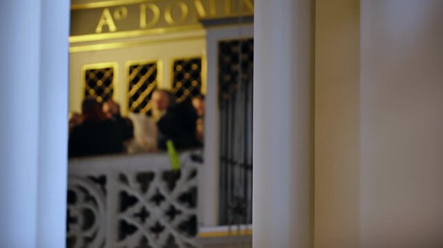 A blurred image of the church choir in a Catholic church.