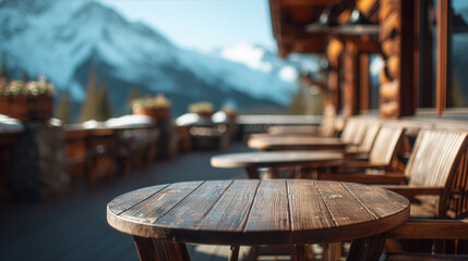 Obraz premium Cozy Mountain Terrace Scene With Tables And Blurred Alpine Landscape