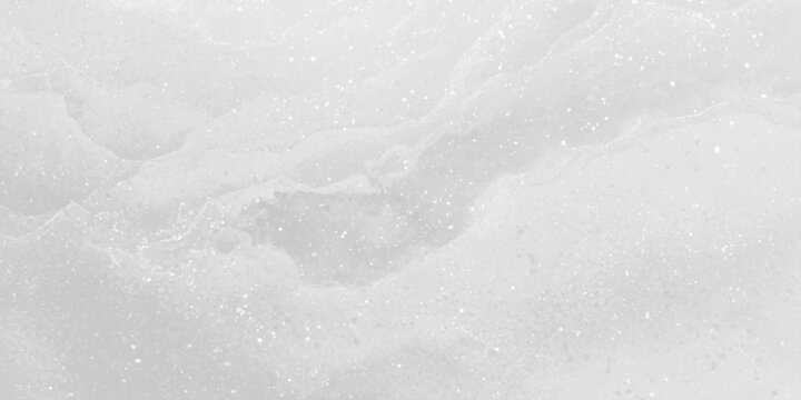 A bright abstract winter pattern of fresh frozen ice and white marble texture creates a cold crystal surface like nature's frost on a window under a blue sky