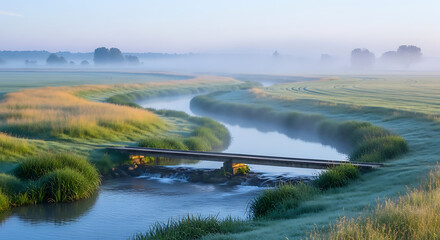 Fototapeta premium Misty River and Bridge at Sunrise Serene Nature Landscape with Golden Hues and Greenery