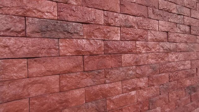 Modern artificial slate stone panels are professionally installed on an interior wall. This textured grey surface adds a sophisticated and rugged aesthetic to the room.