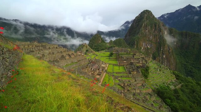Peru's Machu Picchu World heritage site sanctuary Inca Temple early morning landscape clouds fog layer Huayna Picchu Mountain Inca Trail Circuit Aguas Calientes Peruvian Andres Mountains slide right
