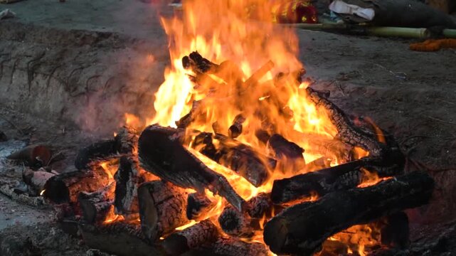 Hindu cremation ritual at Manikarnika Ghat with funeral pyre burning in Varanasi