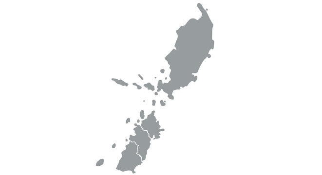A grayscale silhouette map depicts the island of new guinea showcasing its complex coastline and surrounding islands