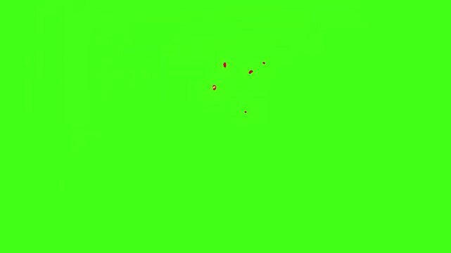 Vibrant red sparks explode on bright green background creating dynamic motion