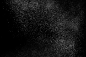 Naklejka premium Water spray mist particle abstract black background texture