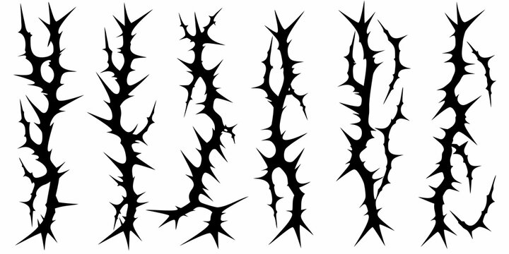 A collection of sharp black thorn like shapes against a white background