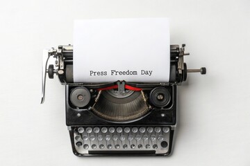 Fototapeta premium Vintage typewriter with paper highlighting press freedom and journalism concept.