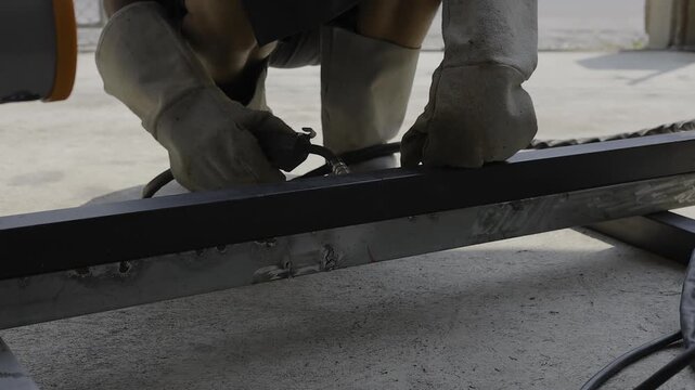 Welder Preparing To Weld Steel Metal Welding Work, A video of a welder gearing up to weld steel, skilled craftsmanship and industrial work, perfect for construction documentary and industrial film.