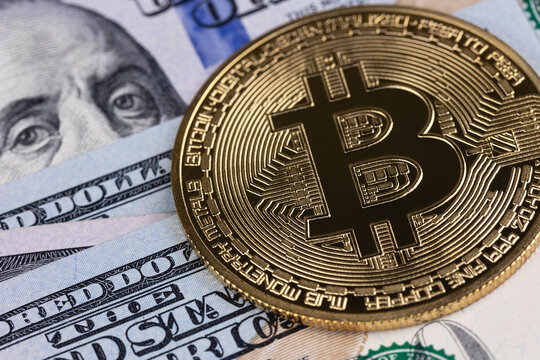 bitcoin cryptocurrency closeup, metal coin cryptocurrency with dollars. Digital cryptocurrency virtual money, blockchain technology. P2P trading, payment system.