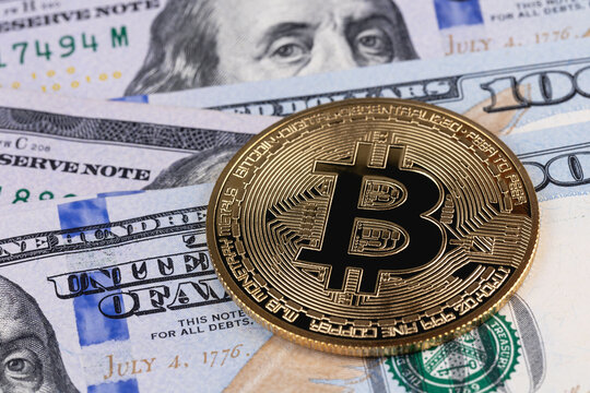bitcoin cryptocurrency coin with dollars closeup. P2P trading, peer-to-peer payment system.