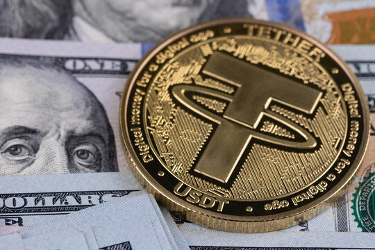 USDT, Tether cryptocurrency symbol closeup with money, dollars. Tether is a cryptocurrency token issued by Tether Limited. Batumi, Georgia - March 20, 2026