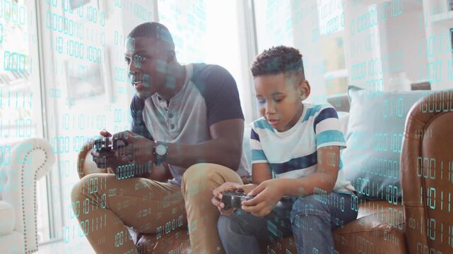 Father and son picking up controllers, playing on couch, binary-code overlay enhancing tech bonding