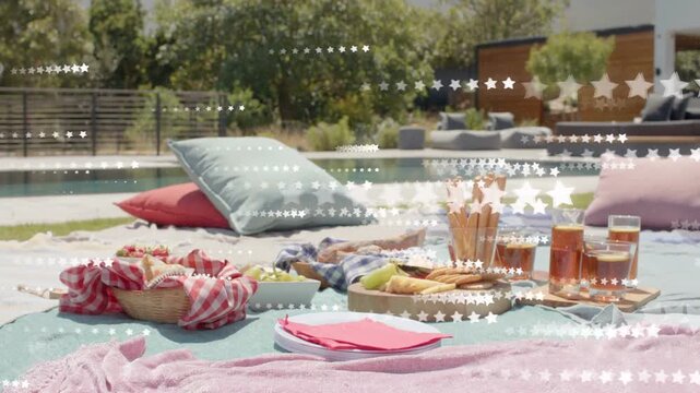 Picnic spread sitting pool, camera panning starting star overlay sweeping across food for marketing