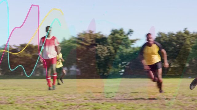 Yellow-bib player passing soccer ball on pitch sparking attack waveform overlays covering goal