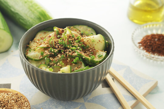 A bowl with Korean cucumber salad Oi Muchim	