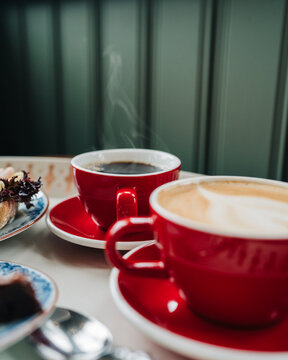 cups of black coffee steaming on a table in a cafe in Stockholm