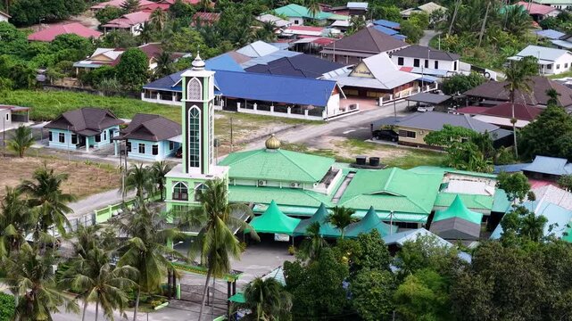 Aerial view of Masjid Bagan Nyiur and surrounding village in Juru, Malaysia.