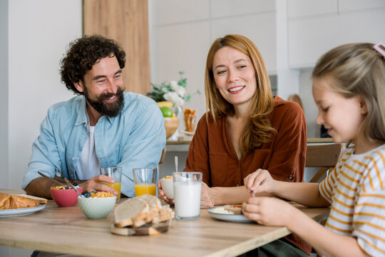 Family enjoying breakfast together in the kitchen