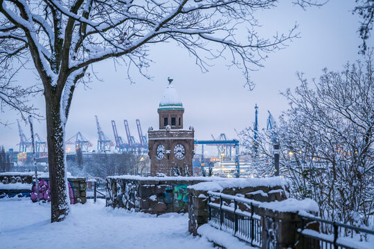 Winter morning with snow at Stintfang clock tower in Hamburg