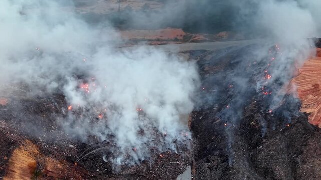 Aerial drone footage of landfill fire burning at site