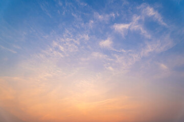 Obraz premium blue bright and orange yellow dramatic sunset sky in countryside texture background.