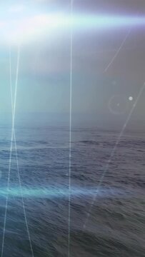 Vertical video: Bright specks appearing, overlay streaks sweeping ocean horizon, forming AR HUD