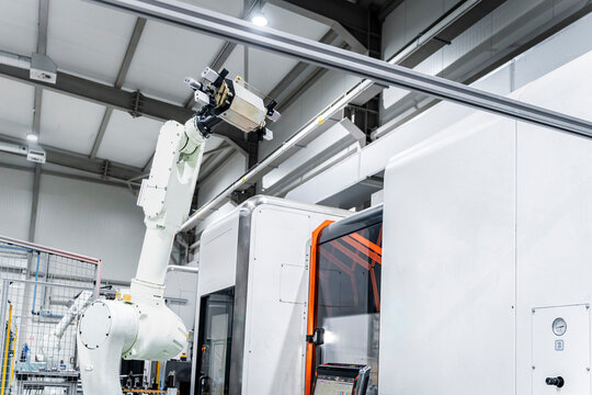 White robotic arm in modern factory