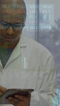 Vertical video: Scientist tapping tablet, monitoring data, charts sliding over torso and window