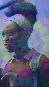 Vertical video: Student answering offscreen question in school hall, purple overlay moving over her