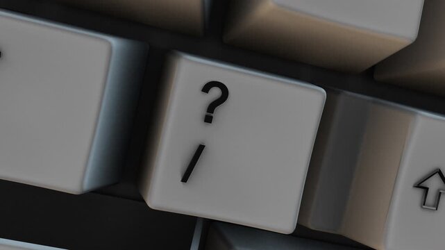 Close-up of ? Question Mark Key on Computer Keyboard with Forward Slash Sign. Great for business presentations, online education, and workplace productivity videos.
