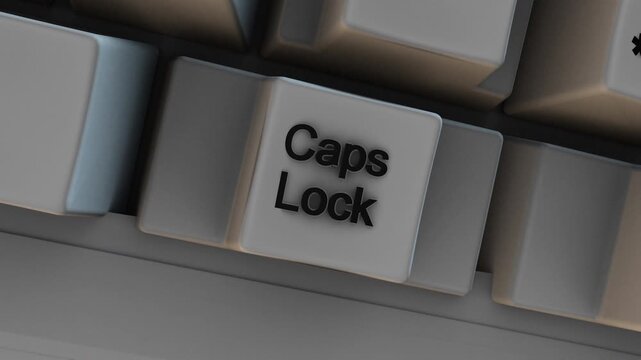 Close-up of Caps Lock Button Key on Computer Keyboard. Great for business presentations, online education, and workplace productivity videos.