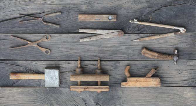 vintage old wooden carpentry tools on a wooden table