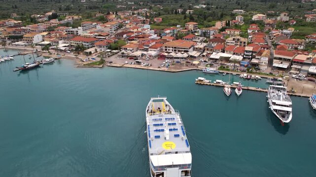 Ferry Arrives in Nydri Port in Lefkada Island Greece, Drone Shot Bird Eye View