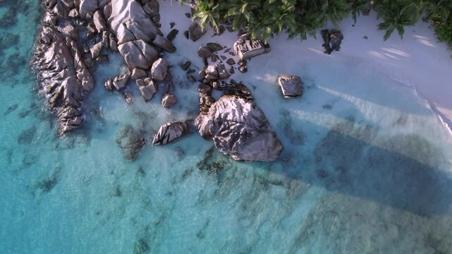 Drone of beautiful rocks near the shoreline of Anse Patates, La Digue, Seychelles 014, 30 fps