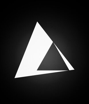 Abstract white geometric triangle shape on black background