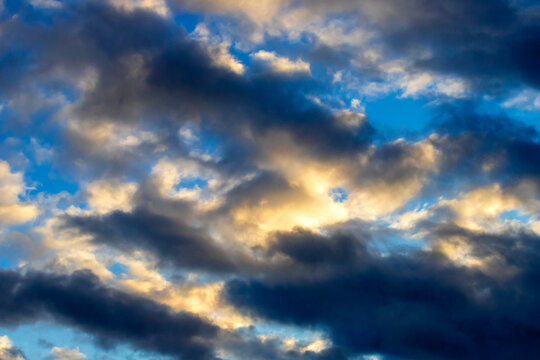 Dramatic dark and golden clouds in the sky