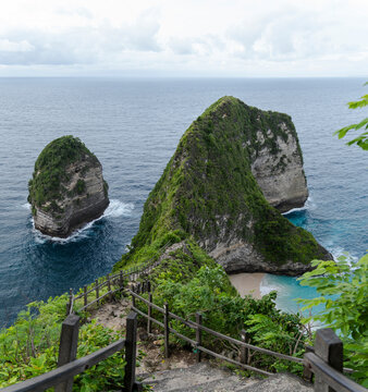 Wooden stairs overlooking Diamond Beach in Nusa Penida Indonesia