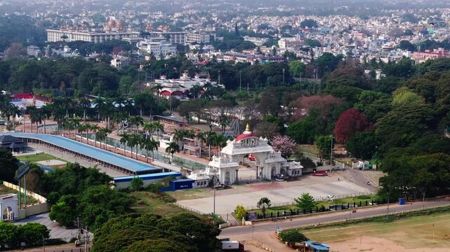 Dasara Exhibition Ground with arch, trees and buildings at mysore, karnataka, india. day time, push in shot, drone shot, 4k.